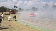 Cristiano Ronaldo shooting balls on the track with Jenson Button
