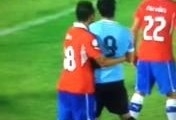 Suarez punch in the face Chile v Uruguay